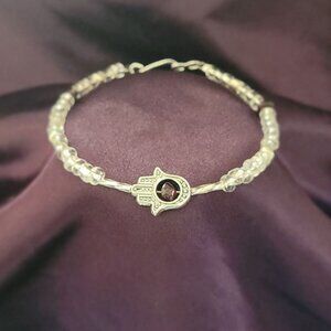 Garnet in the palm of the Hamsa hand bracelet